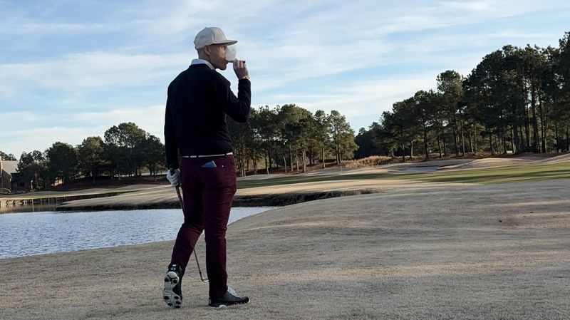 Chad on the golf course with cigar - Freedom Journey Life